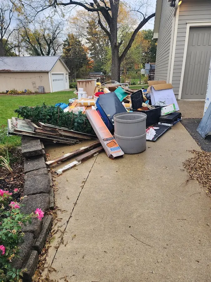 Dumpster being loaded with debris for Roofing Dumpster Rental in Newport Beach